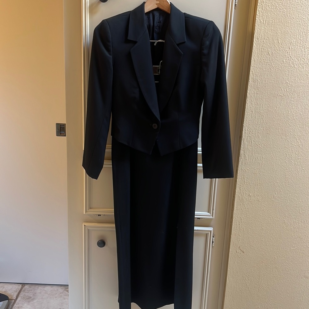 Beautiful Manuel short jacket with full length straight skirt Left leg slit.